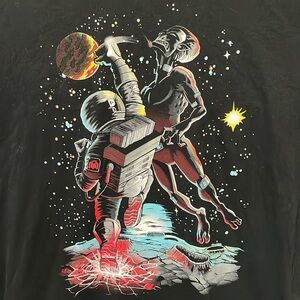 Astro man uppercutting a Alien 👽 Tee 🔥